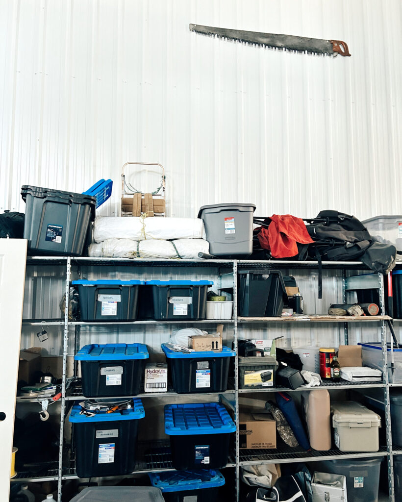 Storage shelves in garage with outdoor equipment