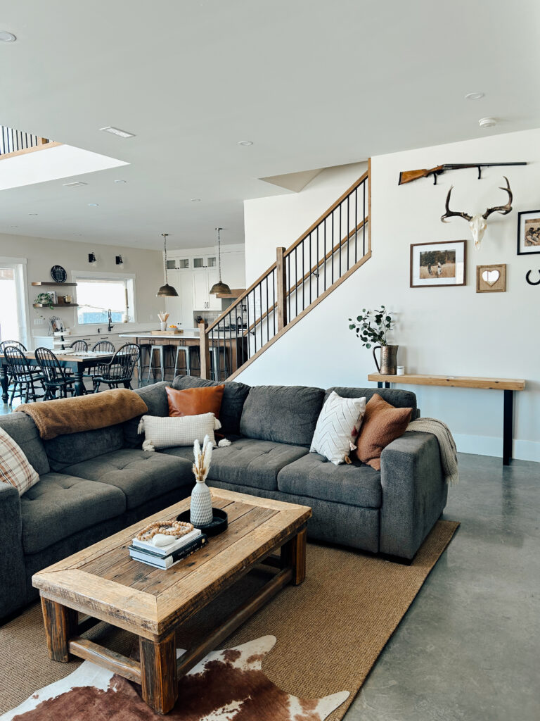grey and brown living room with cowhide rug