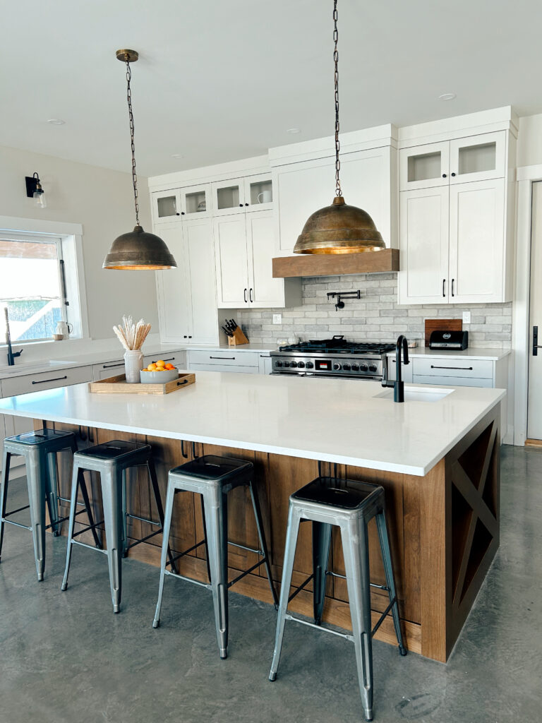 Brown and white modern farmhouse style kitchen with large island