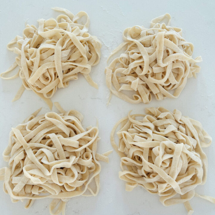 uncooked fresh pasta noodles on a white counter top