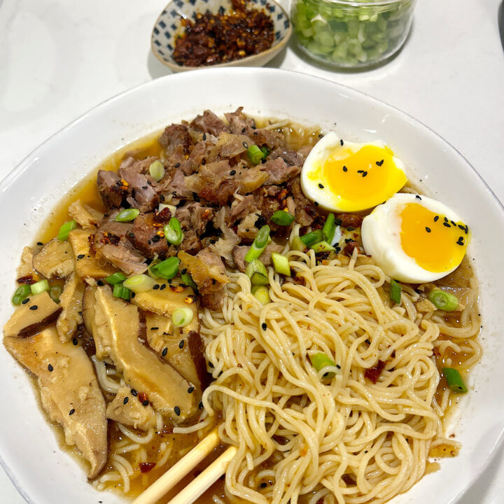 noodle soup in a white bowl on a white counter