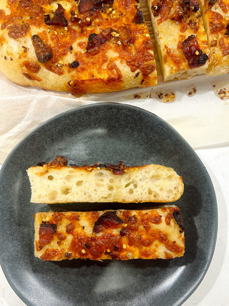 sliced cheese bread on black plate