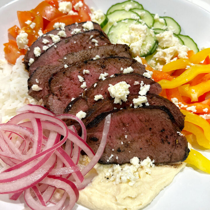 rice bowl with vegetables nd sliced meat