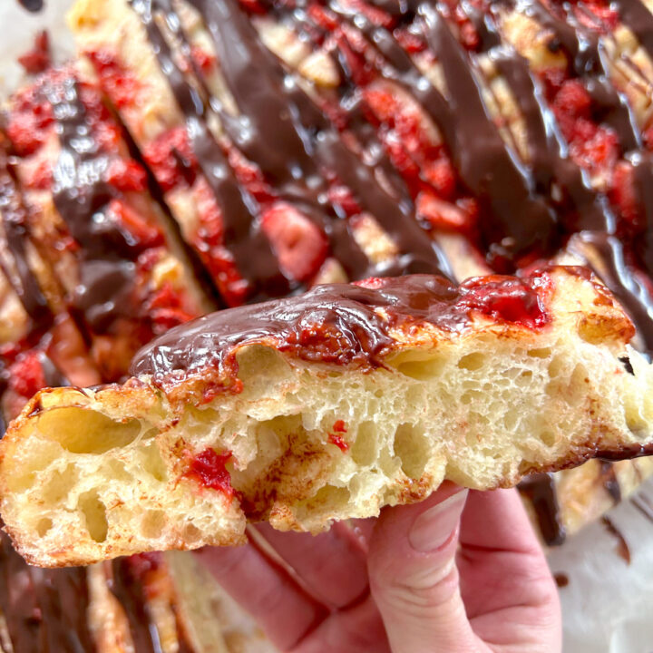 focaccia bread topped with strawberries and chocolate ganacha