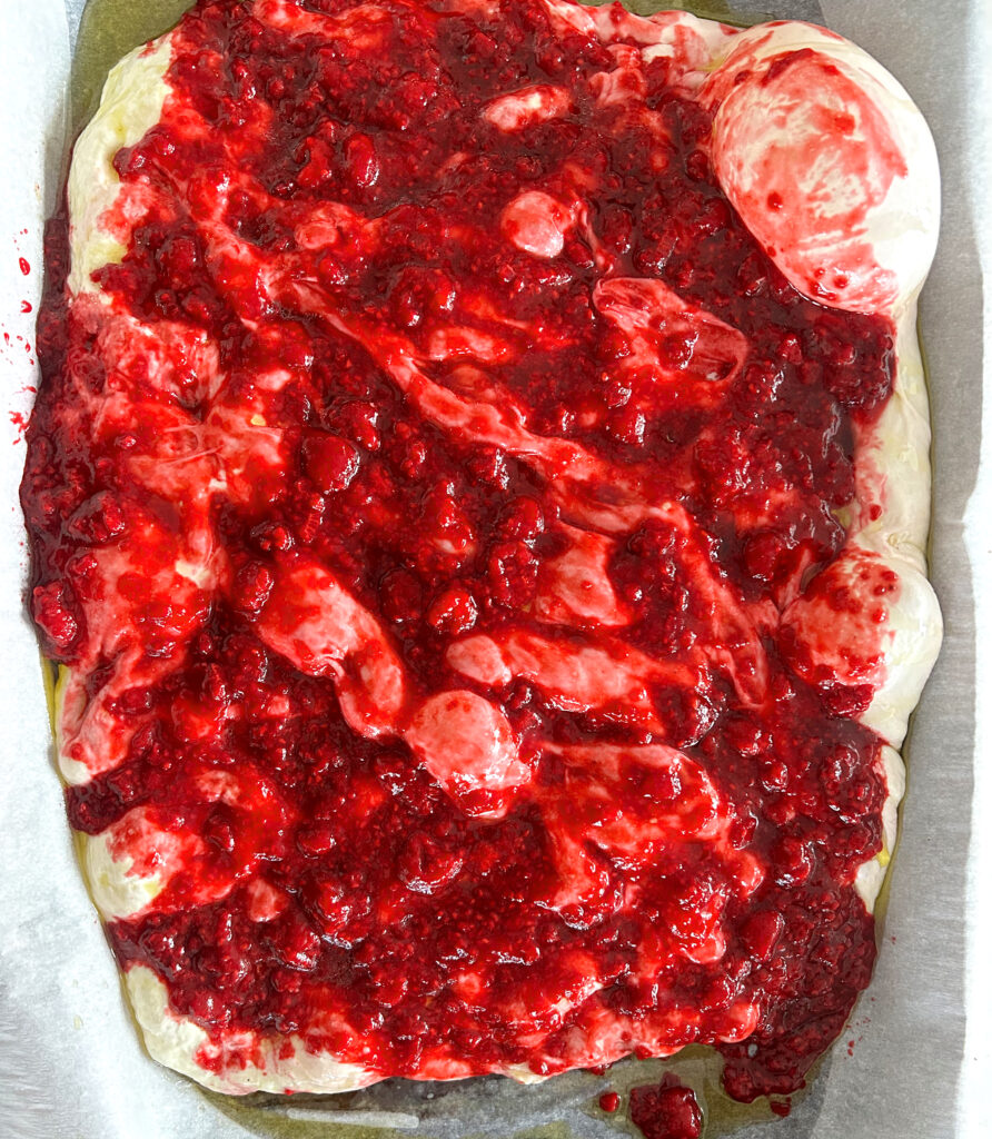 sourdough focaccia bread dough with raspberry sauce on top