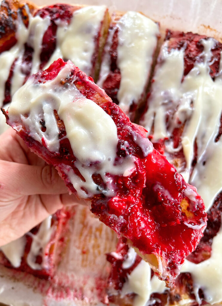 focaccia bread with raspberries and cream cheese icing