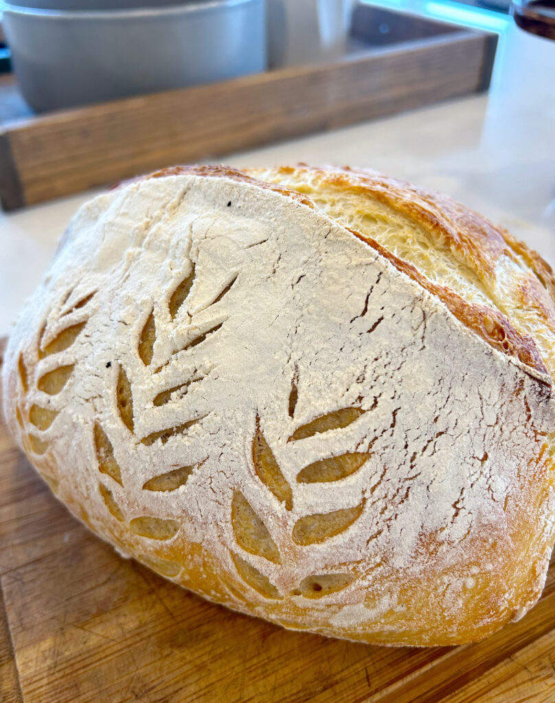 fresh loaf of bread on a wood board