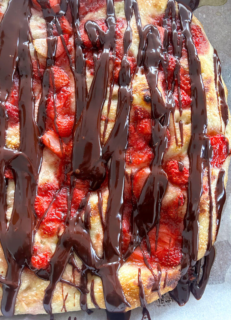 focaccia bread with strawberries and chocolate on top