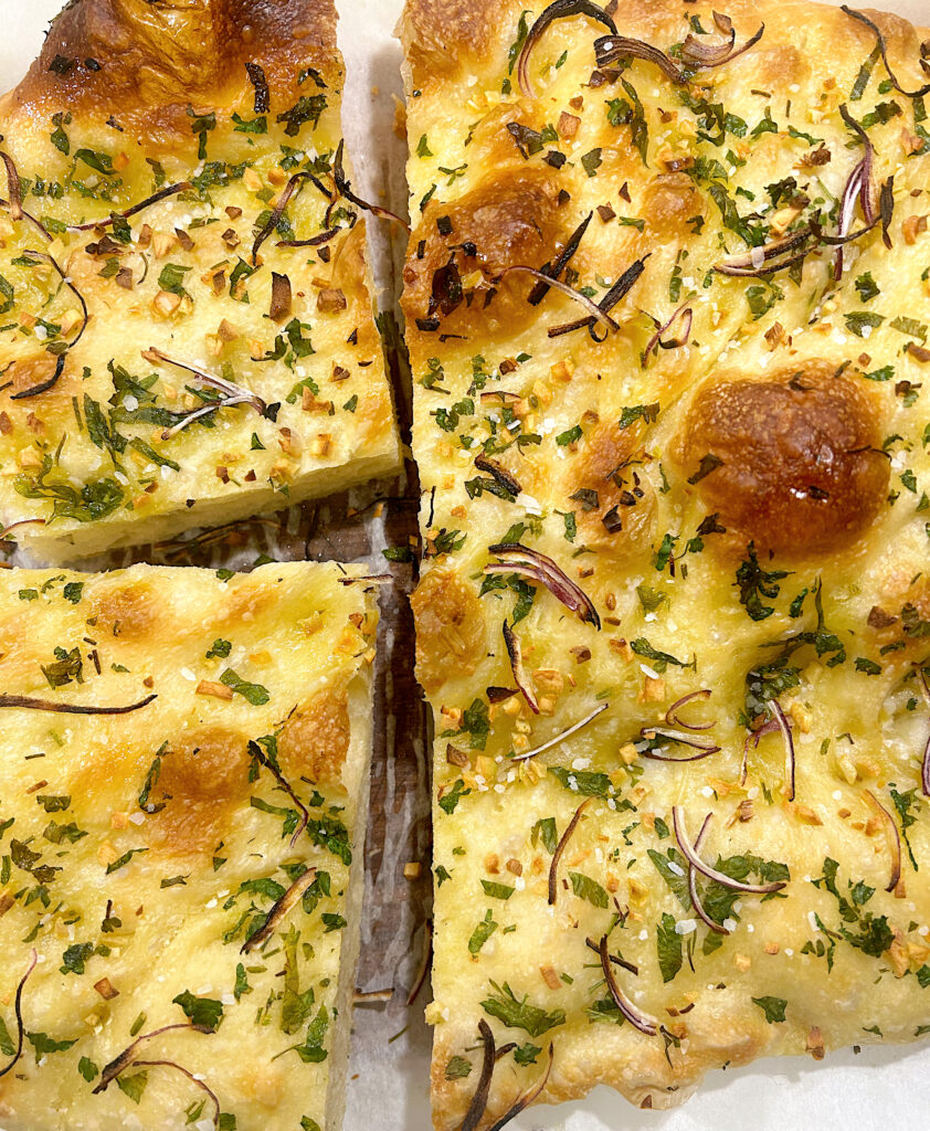 fresh baked bread with herbs and onion