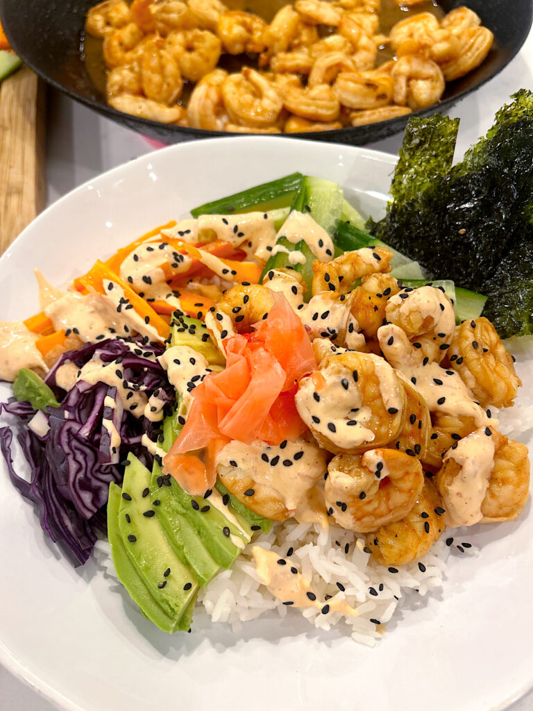 poke bowl with rice, vegetables and prawns