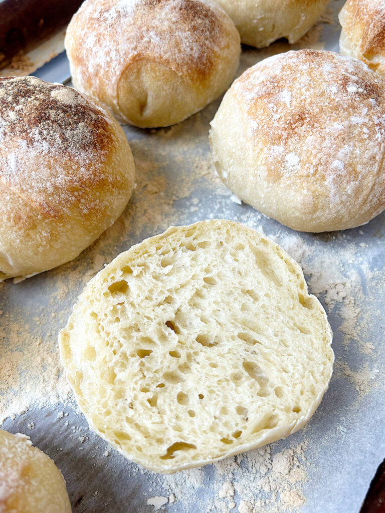 fresh baked buns on a baking sheet