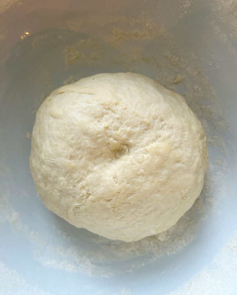 dough ball in a white bowl