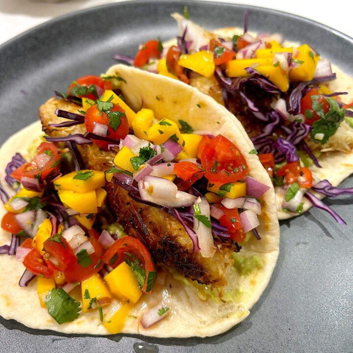 fish tacos with mango salsa on homemade tortilla