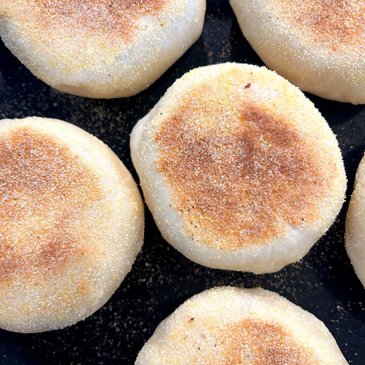 English muffins cooking in a cast iron skillet