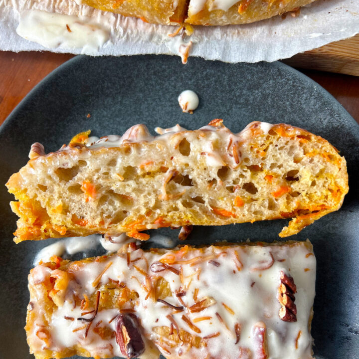 2 slices of carrot focaccia bread on a black plate