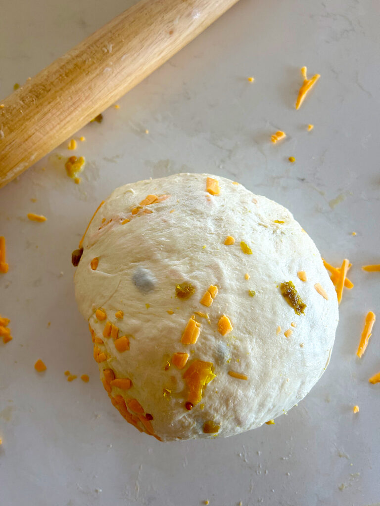 ball of dough with cheese in it