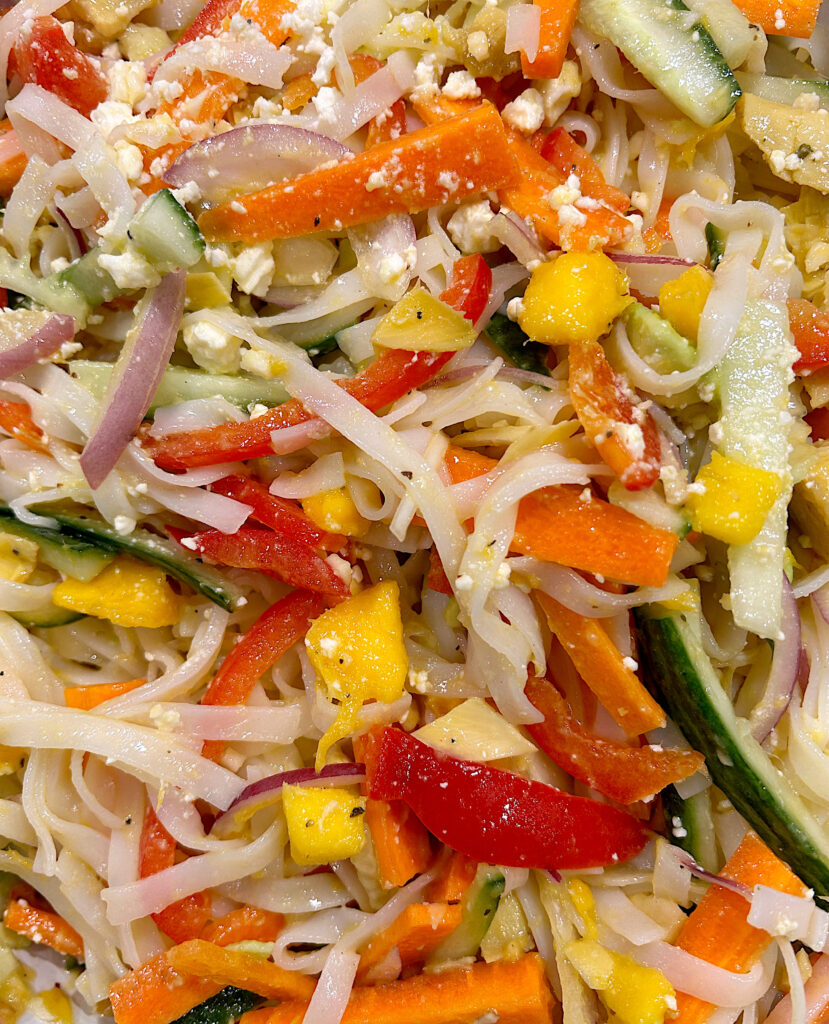 salad with rice noodles, mango and vegetables