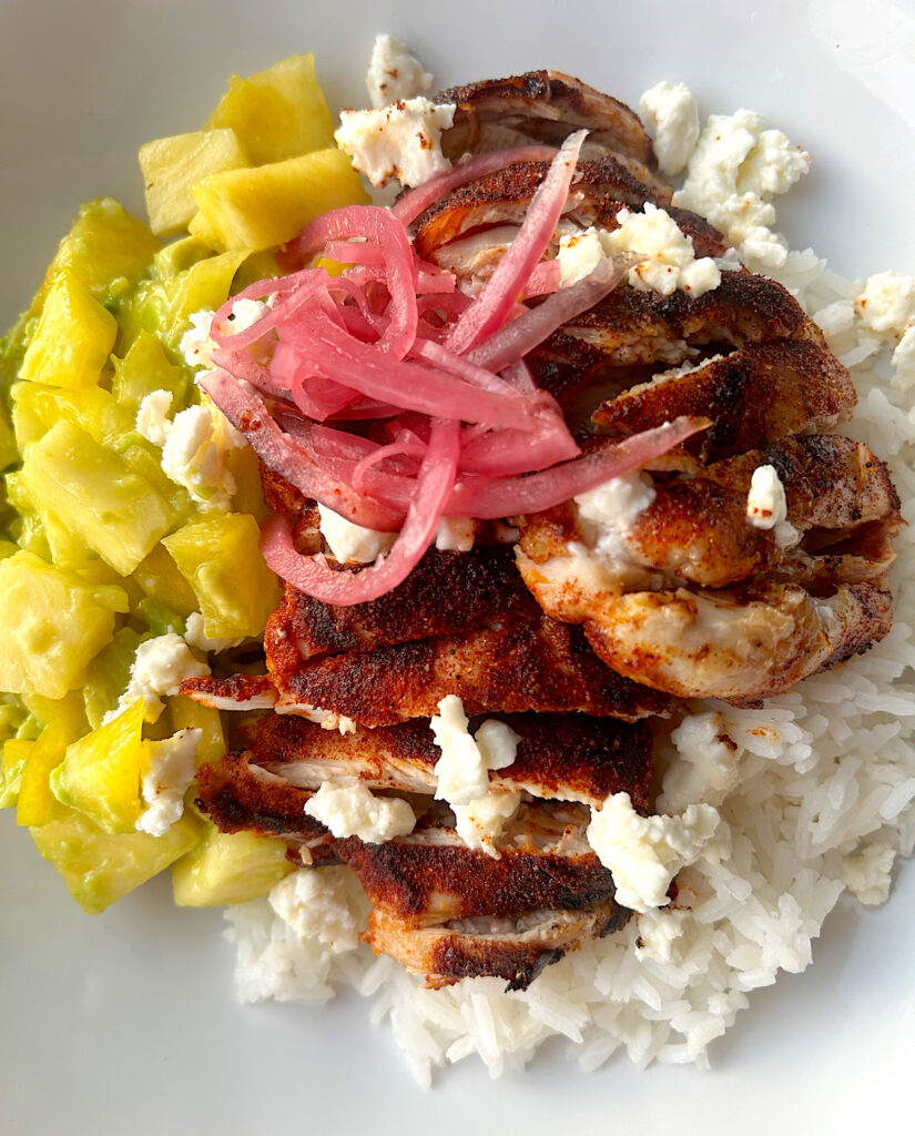 rice bowl with chicken, pineapple and pickled onions