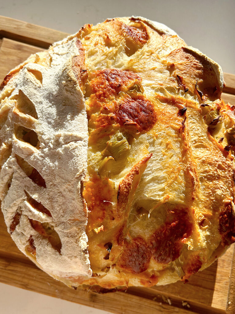 crispy soudough bread with cheese on a wood board