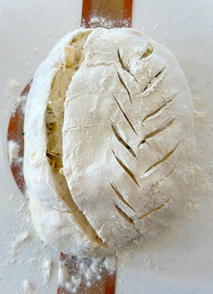 unbaked bread with decortive scoring