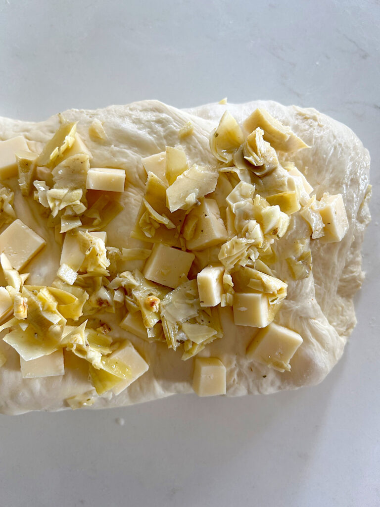 bread dough folded with artichokes and cheese