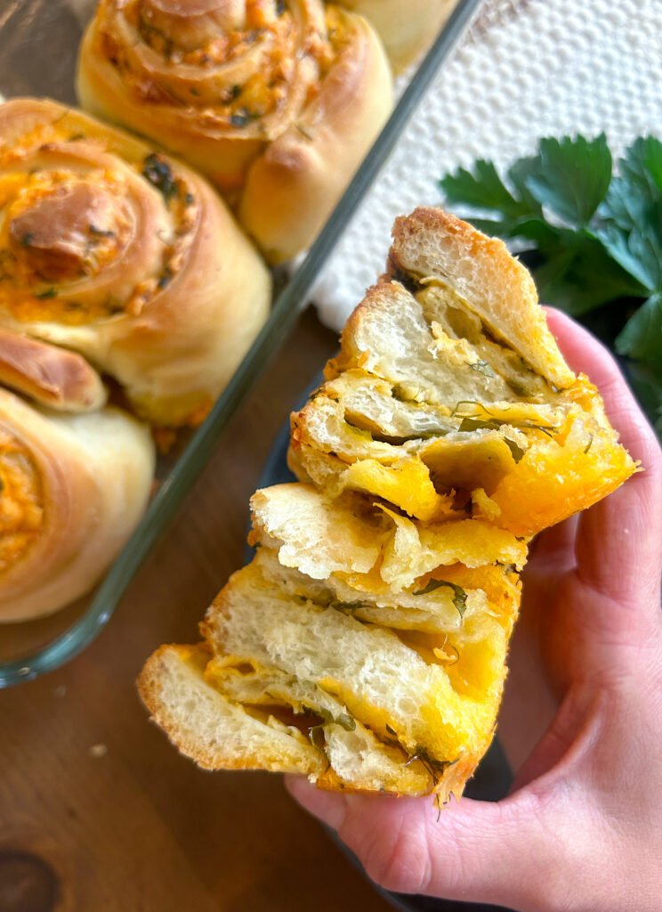 cheesy sourdough roll cut in half 
