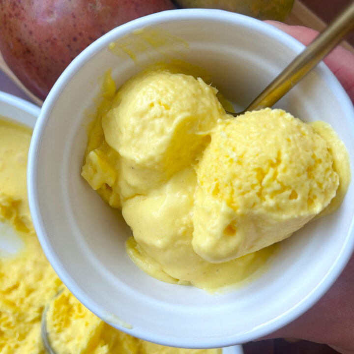 small white bowls with healthy mango ice cream