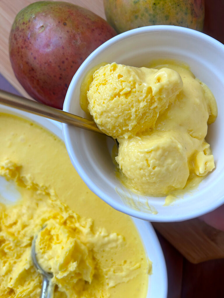 white bowl of creamy mango ice cream