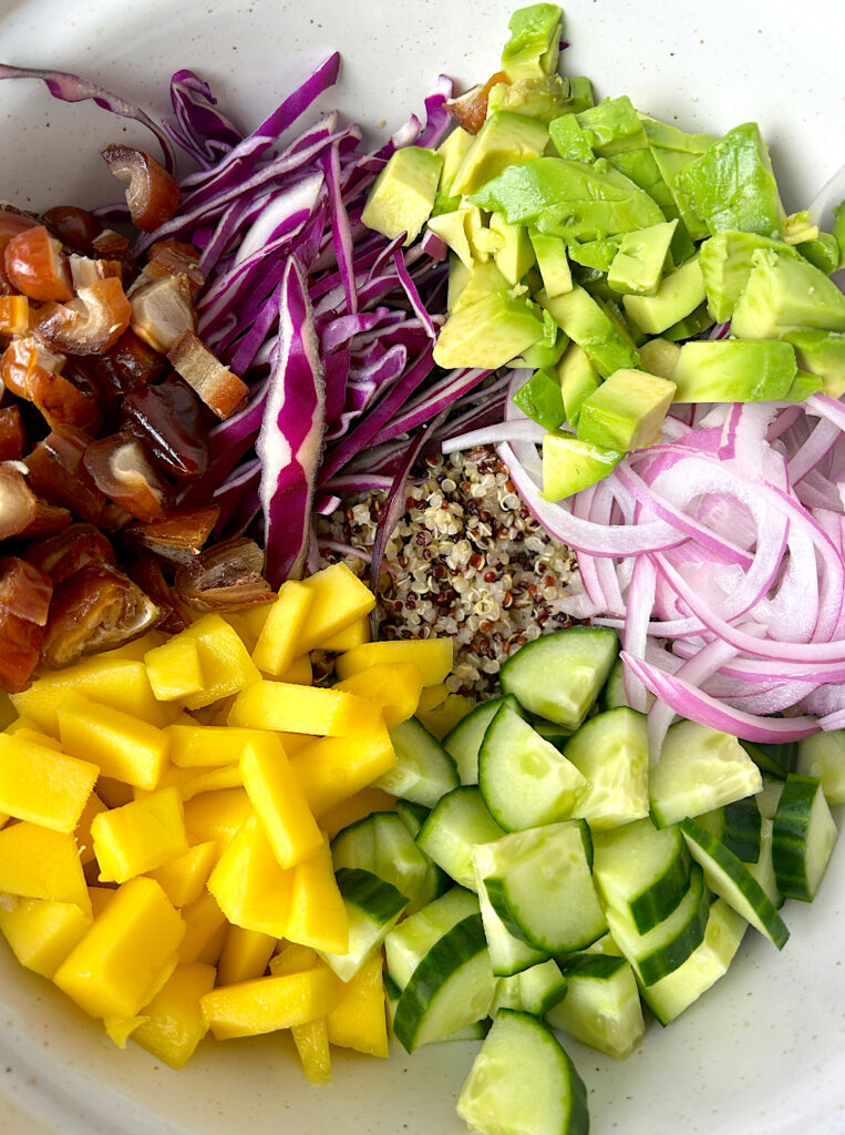 quinoa salad with mango, dates, avocado, cucmber and cabbage