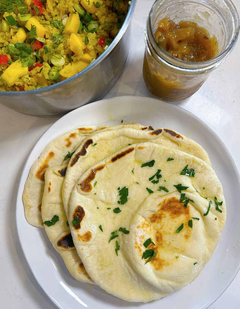 plate of sourdough naan bread, with a side of rice