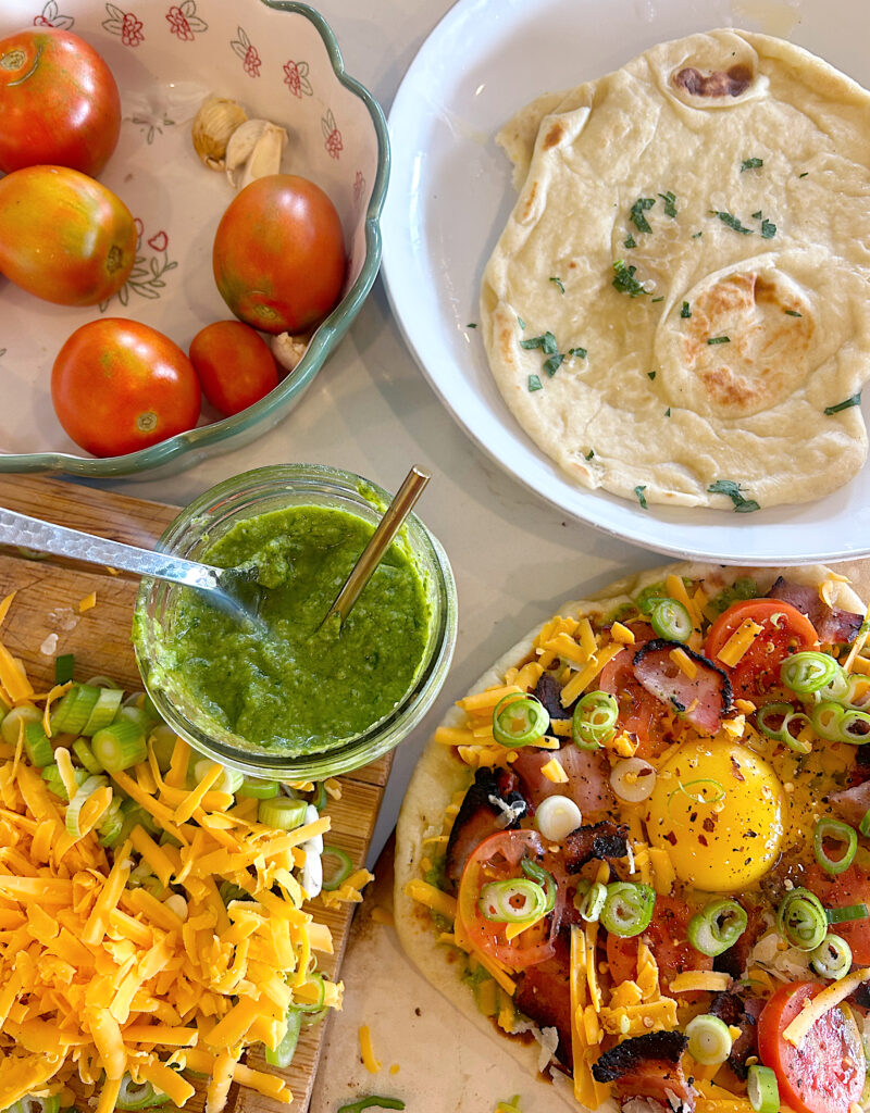 breakfast pizzas made with naan bread and pesto