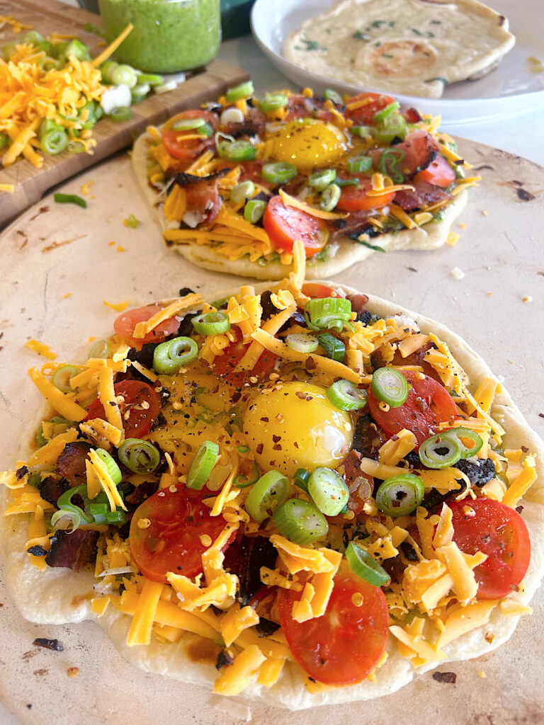 sourdough naan pizza with egg, cheese and tomato