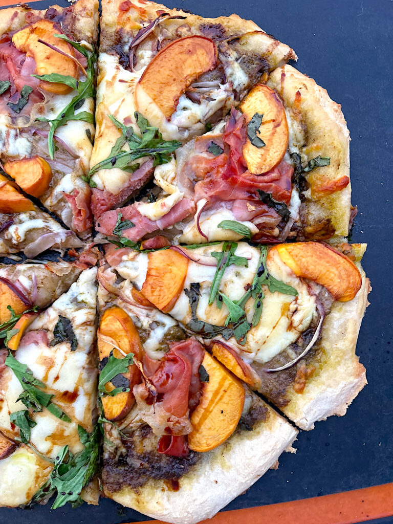 sliced pizza with peaches