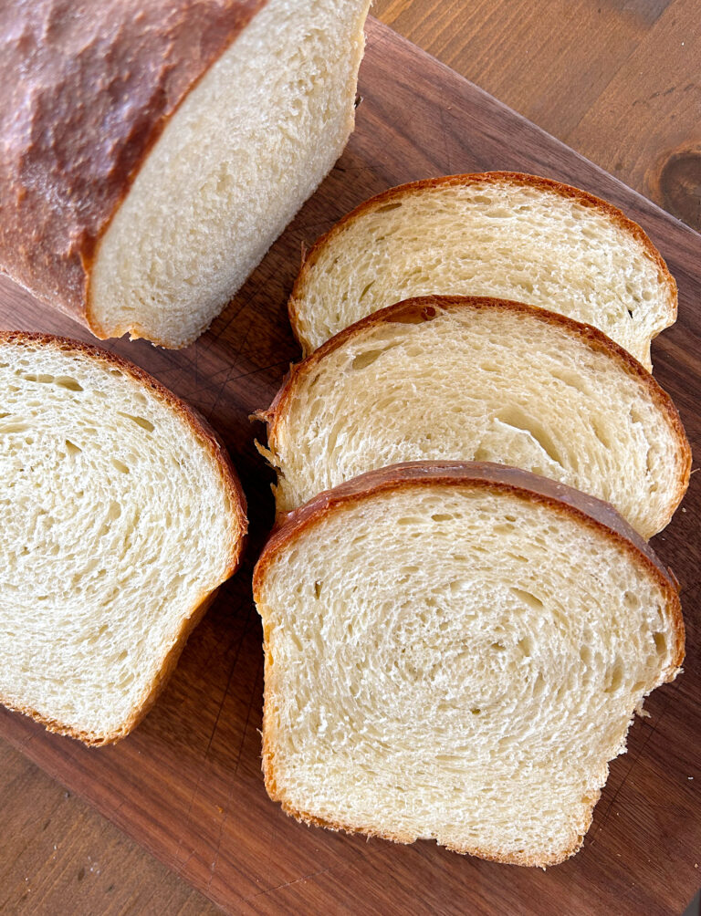 sandwich bread slices on a wood board