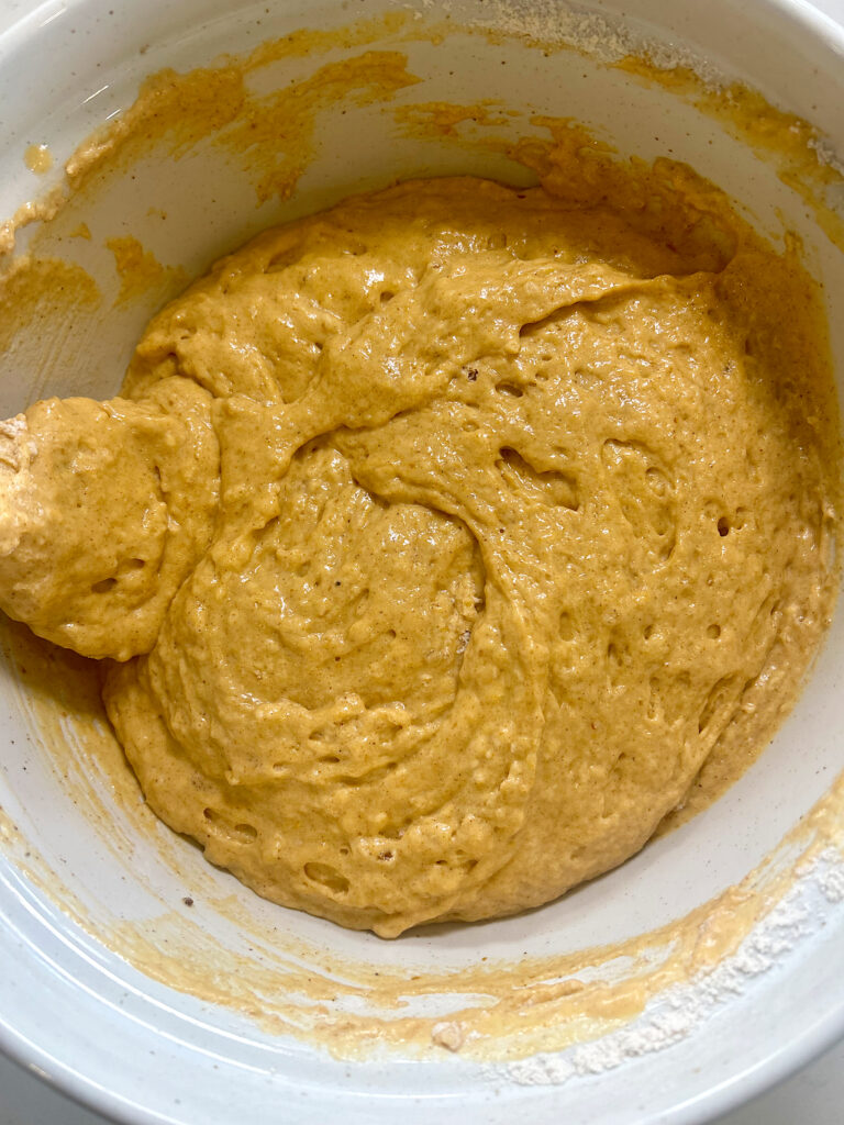 pumpkin pancake batter in a white bowl