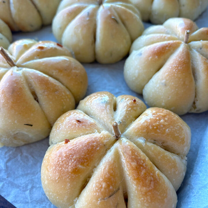sourdough buns with rosemary and garlic in the shape of pumpkins