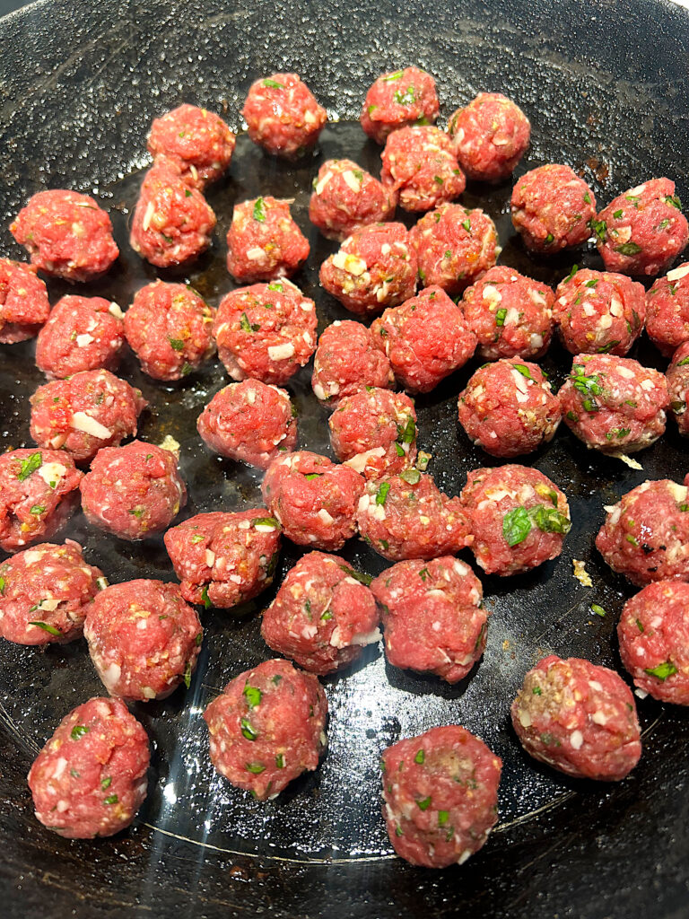 venison Italian meatballs in a frying pan