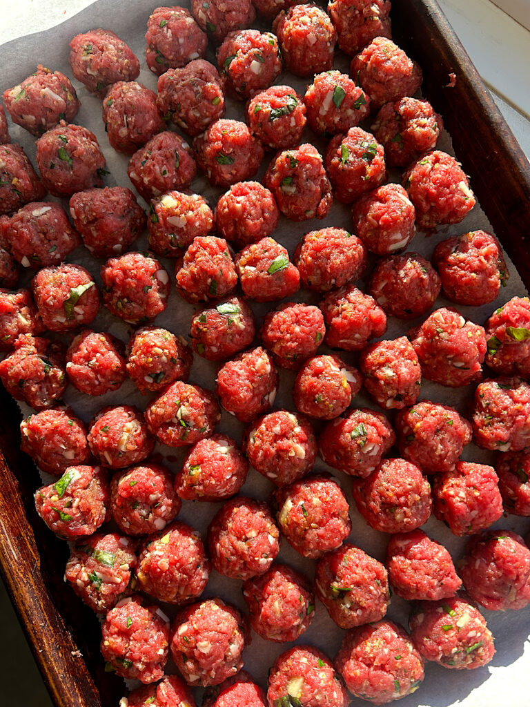 venison meatballs on a baking sheet