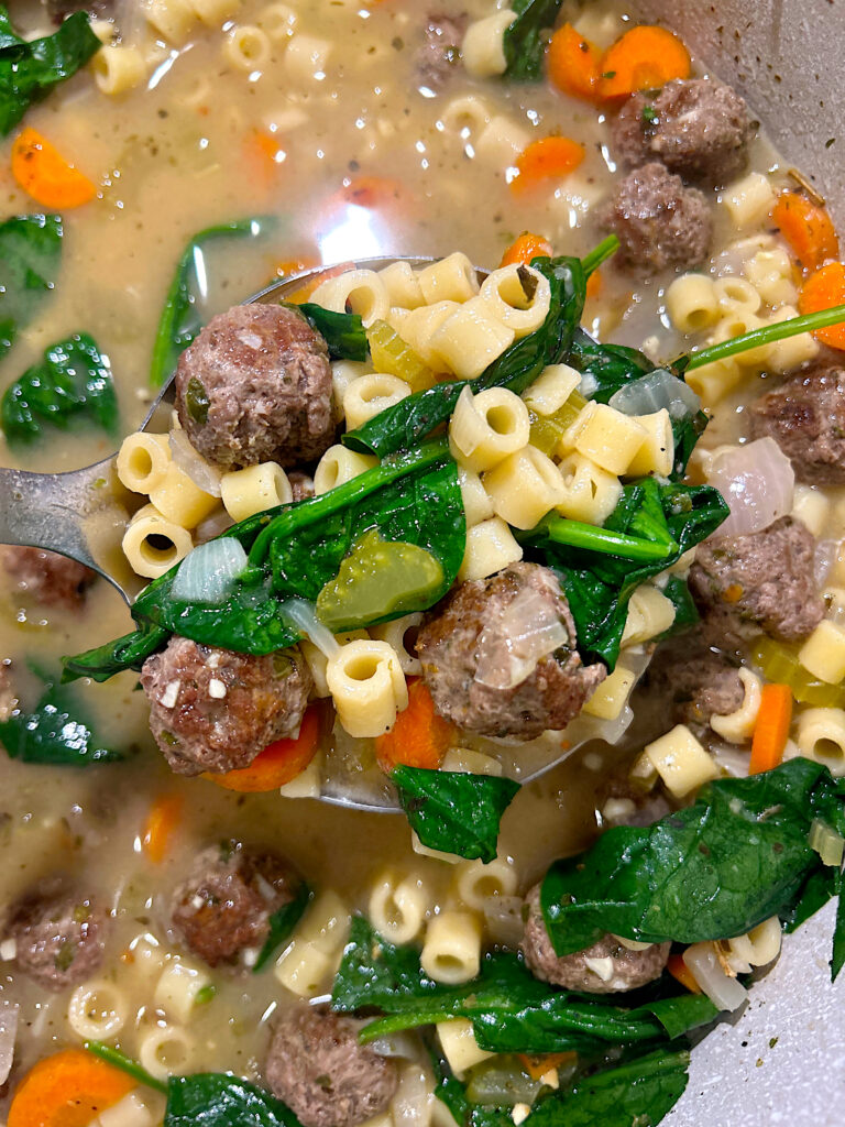 meatball and noodle soup in a pot