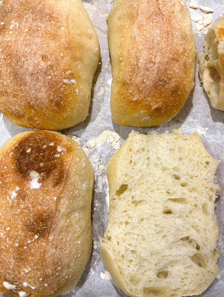 ciabatta buns on a baking sheet
