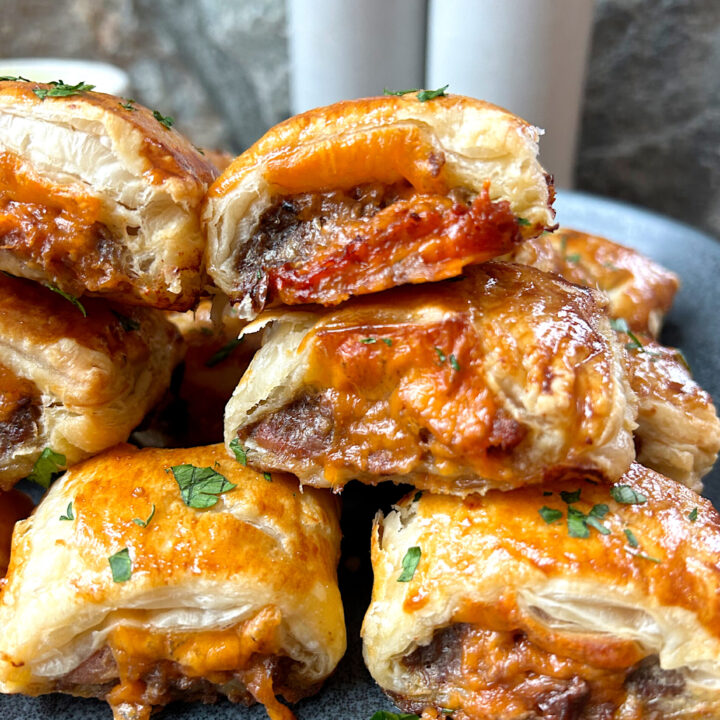 a pile of cheesy breakfast sausage rolls