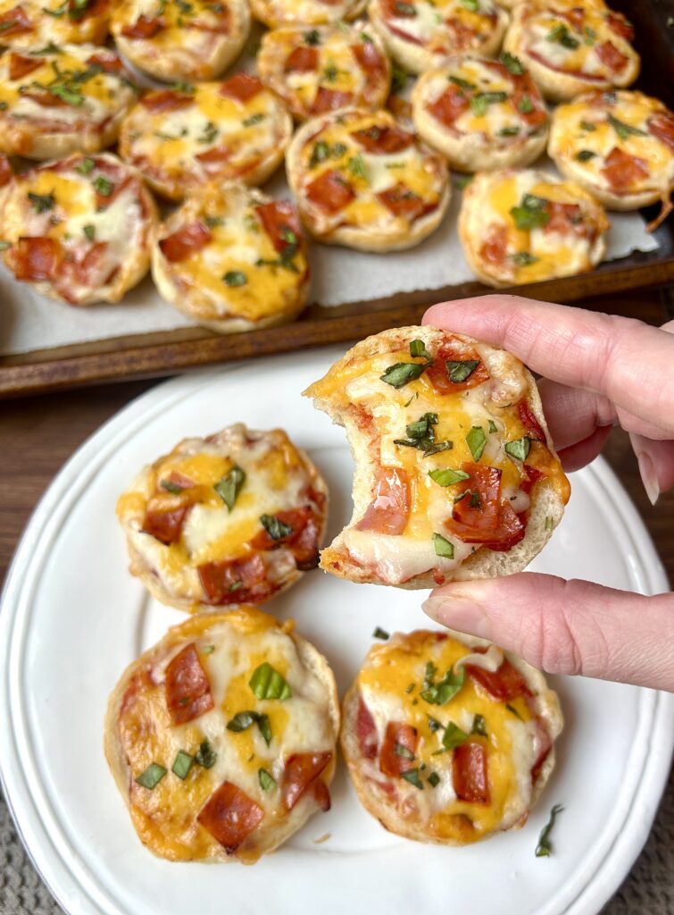 mini pizza bagels on a white plate