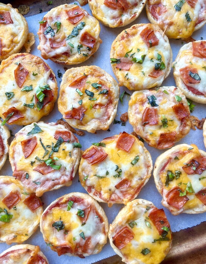 mini pizza bites with cheese, pepperoni and basil