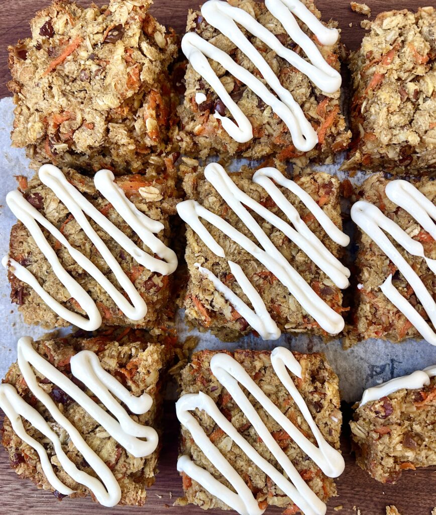 carrot and oatmeal bars with cream cheese icing drizzle on top