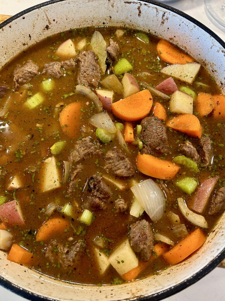 a large pot of venison stew with carrot and potatoes