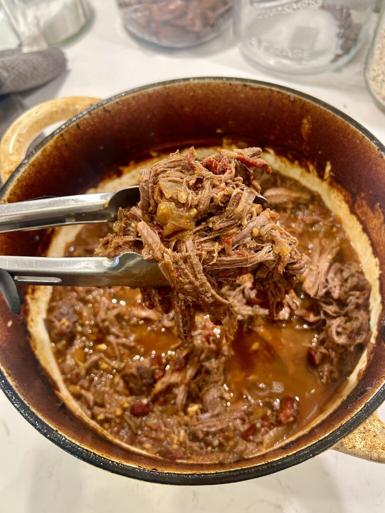shredded meat in a large pot