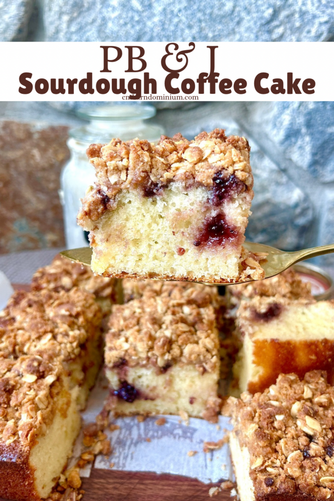 a slice of coffee cake with peanut butter, jam and a crumble topping