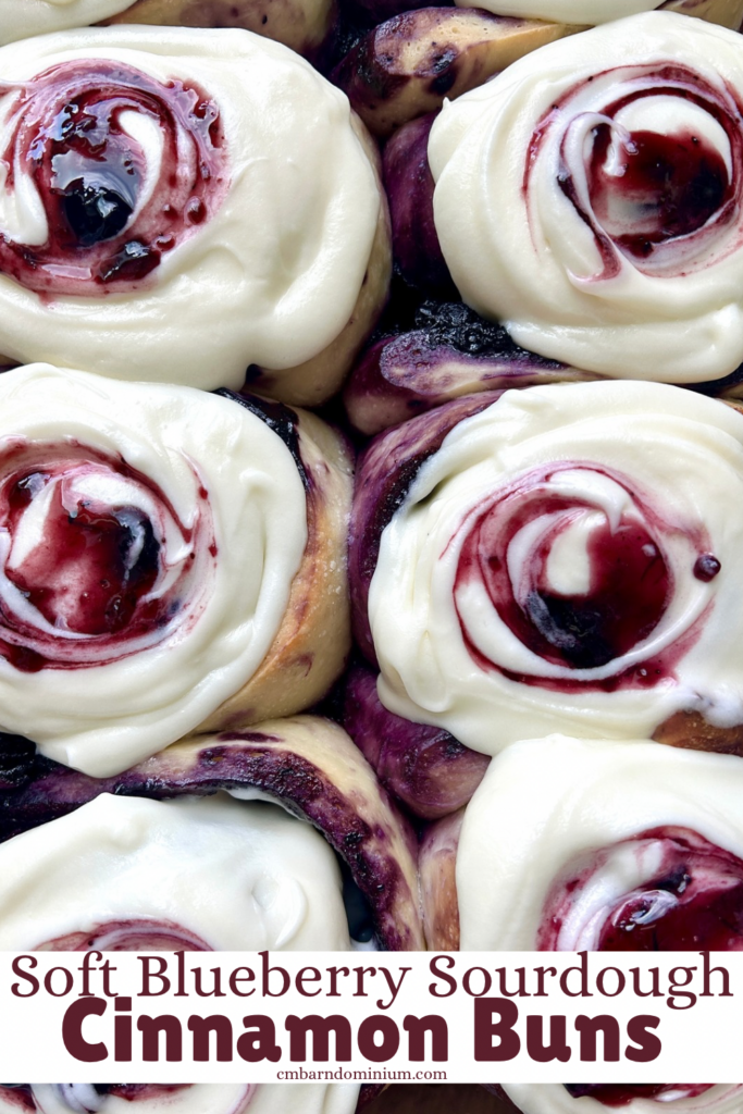 blueberry cinnamon buns with icing and blueberry swirl on top