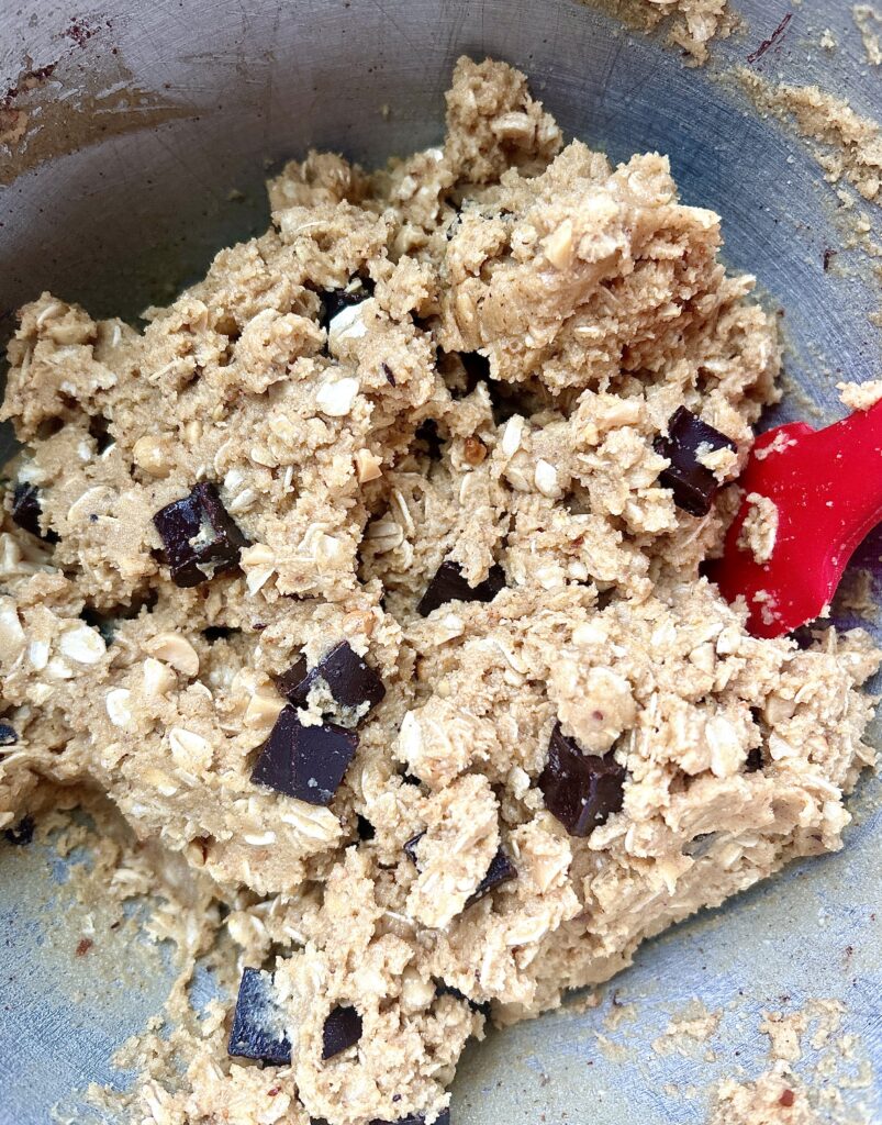 cookie dough in a stainless bowl with chocolate chunks