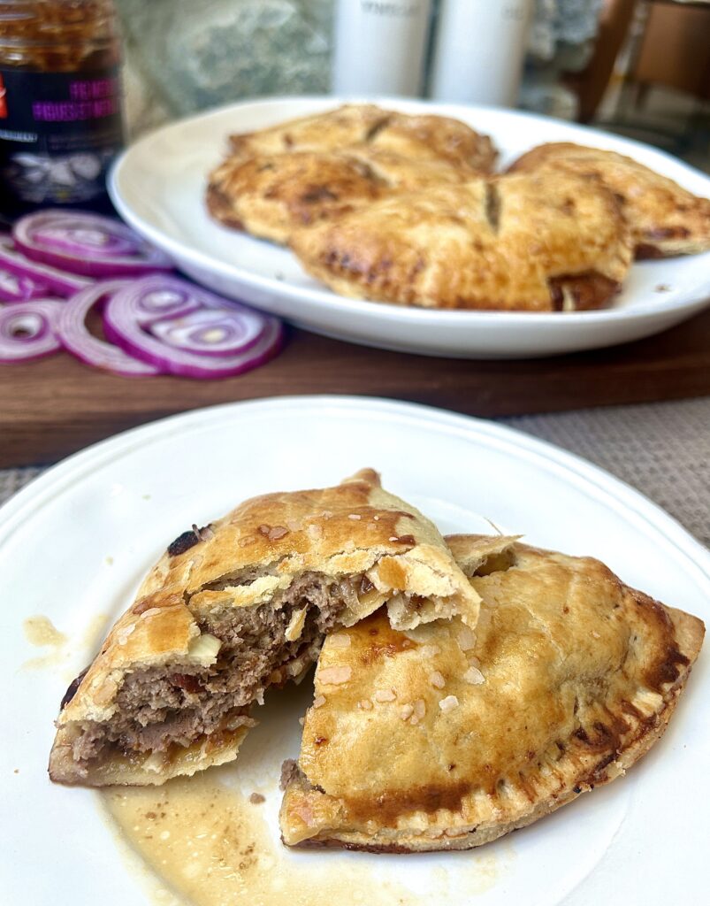 a white plate with savoury hand pies on it